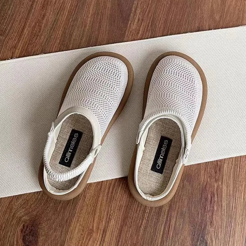 Milky white slip-on shoes with a hollow patterned linen upper and mesh lining, shown on a foot.