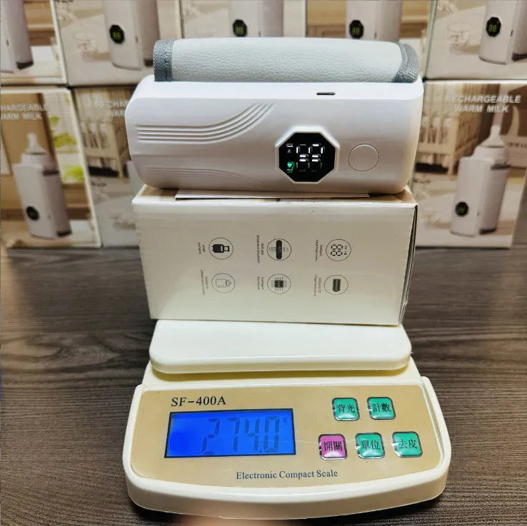 Grey and white car charger electric milk warmer for baby bottles with 12V plug.