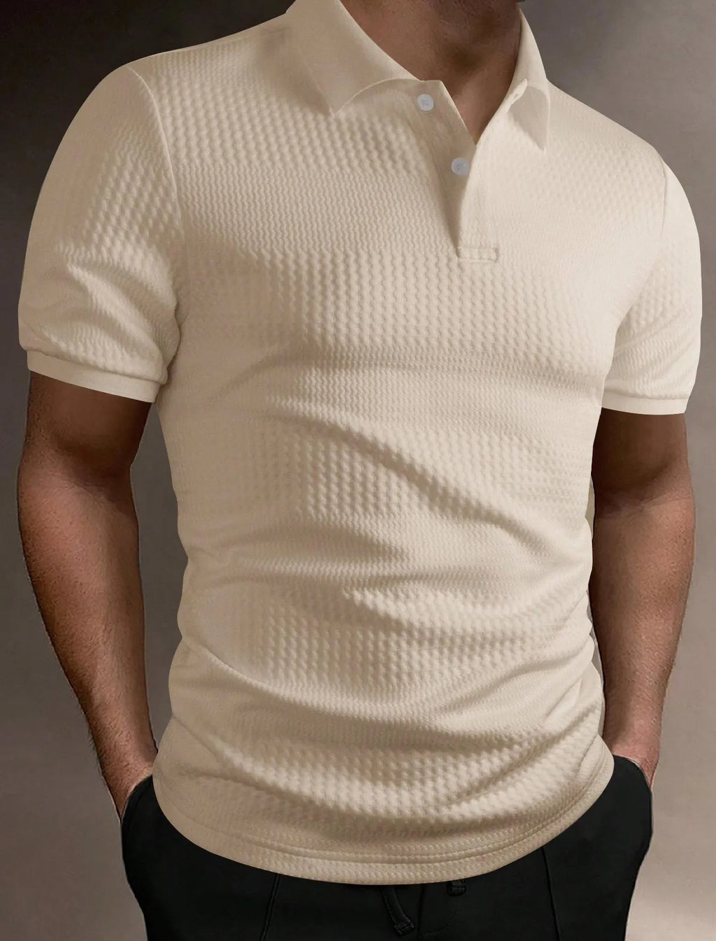 Man wearing a striped loose-fit polo shirt in light blue, showing short sleeves and asymmetric detail.