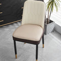 Leather horseshoe-shaped seat cushion in beige colour on a dining chair.
