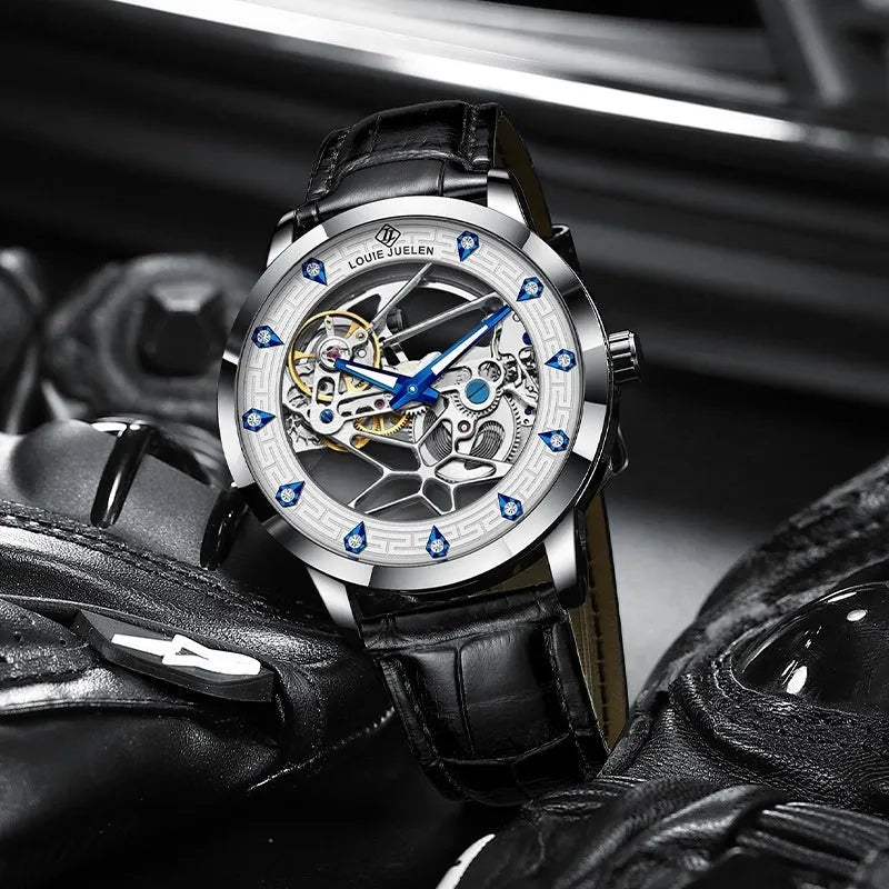 Men's silver case mechanical watch with white dial, blue hands, and black genuine leather strap.