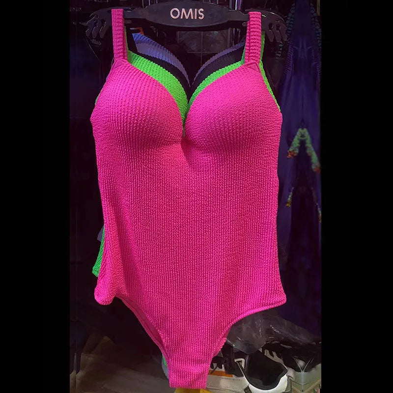 Women's black sleeveless one-piece swimsuit made from polyester fabric on a mannequin.