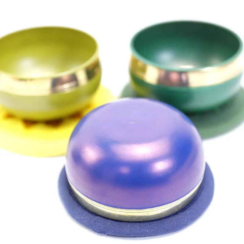 Handmade Himalayan singing bowl percussion instrument in multiple colours for meditation and yoga