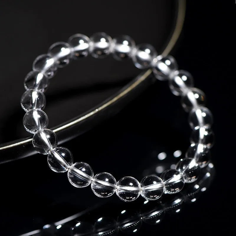 White crystal bracelet with round beads in various sizes from 6mm to 14mm diameter