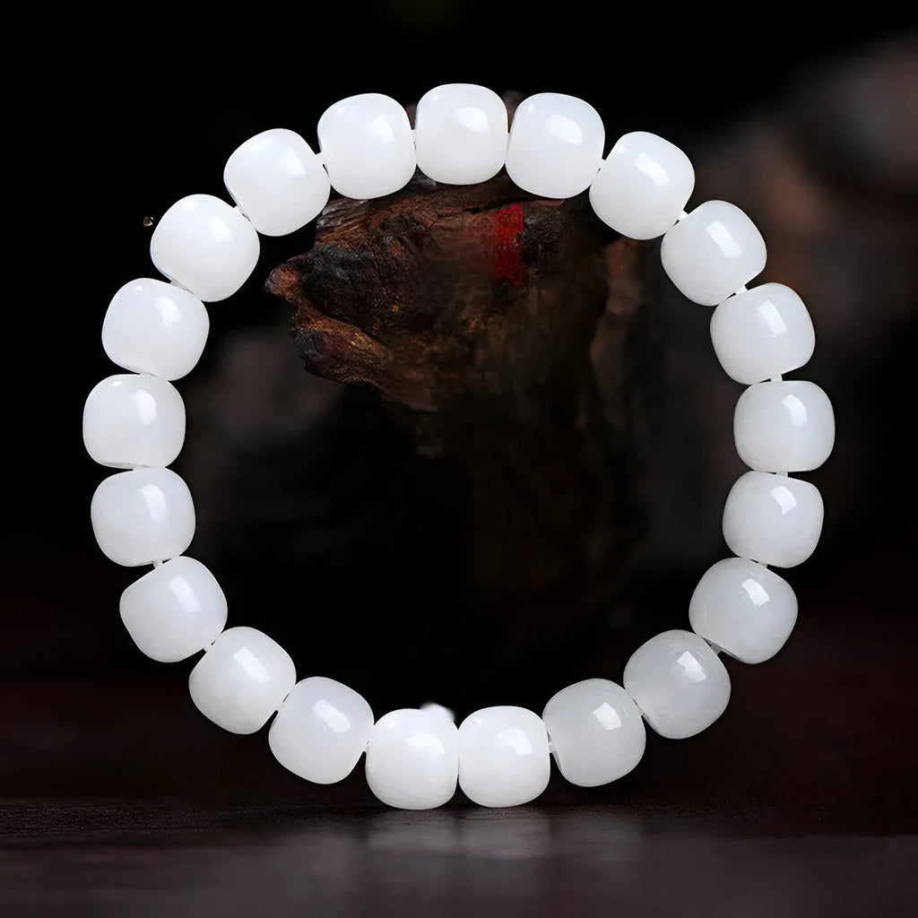 White Hetian jade barrel bead bracelet showing three size options: 5x6mm, 7x8mm, and 8x10mm on a neutral background.