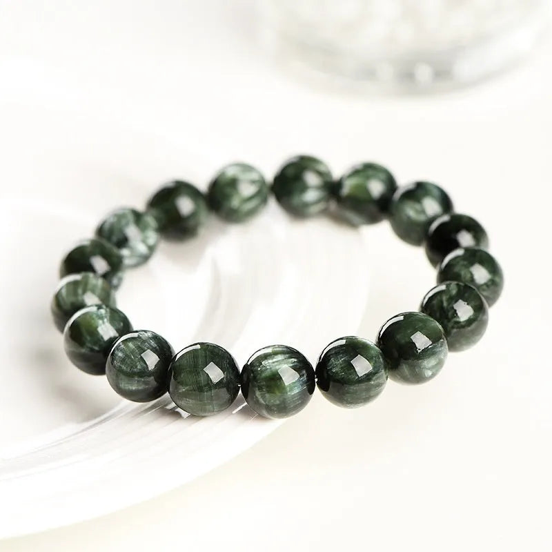 Green Dragon Crystal bracelet with round beads featuring Ruyi design elements.