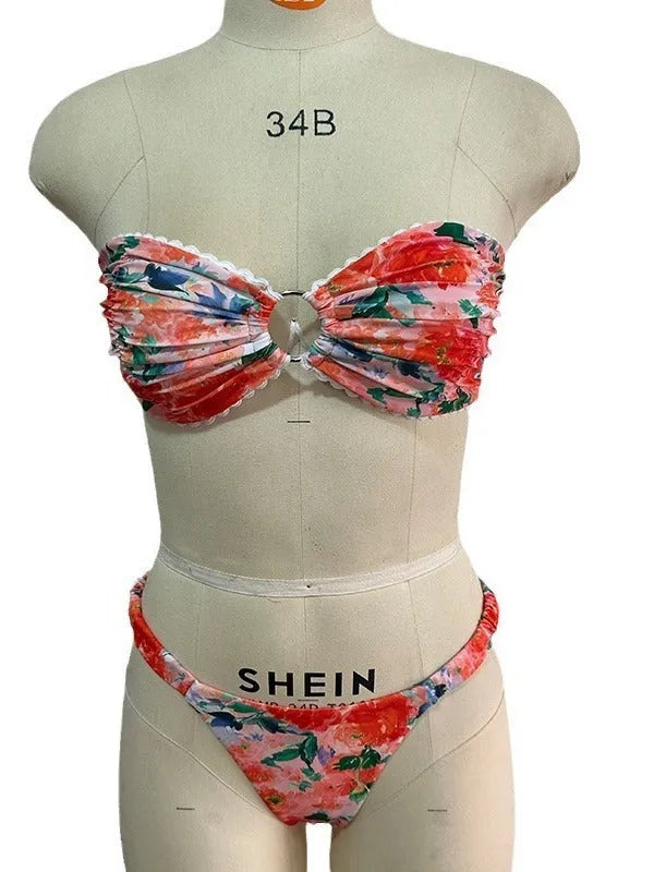 Women's floral print bikini set with lace trim on a backless tube top and matching briefs.