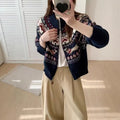 Beige ethnic Jacquard pattern pullover sweater with 3D effect and round neck on a hanger.
