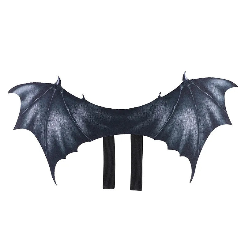 Black cloth bat wing costume accessory for a dog or cat on a Halloween background.