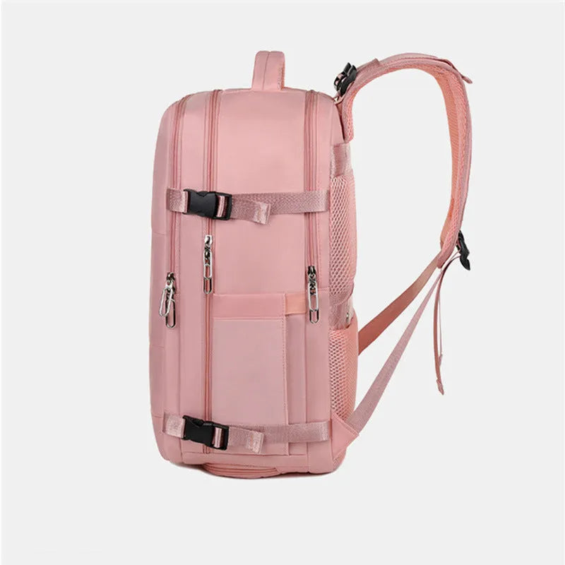 Large purple women's travel backpack with multiple pockets and air pillow belt on a grey background