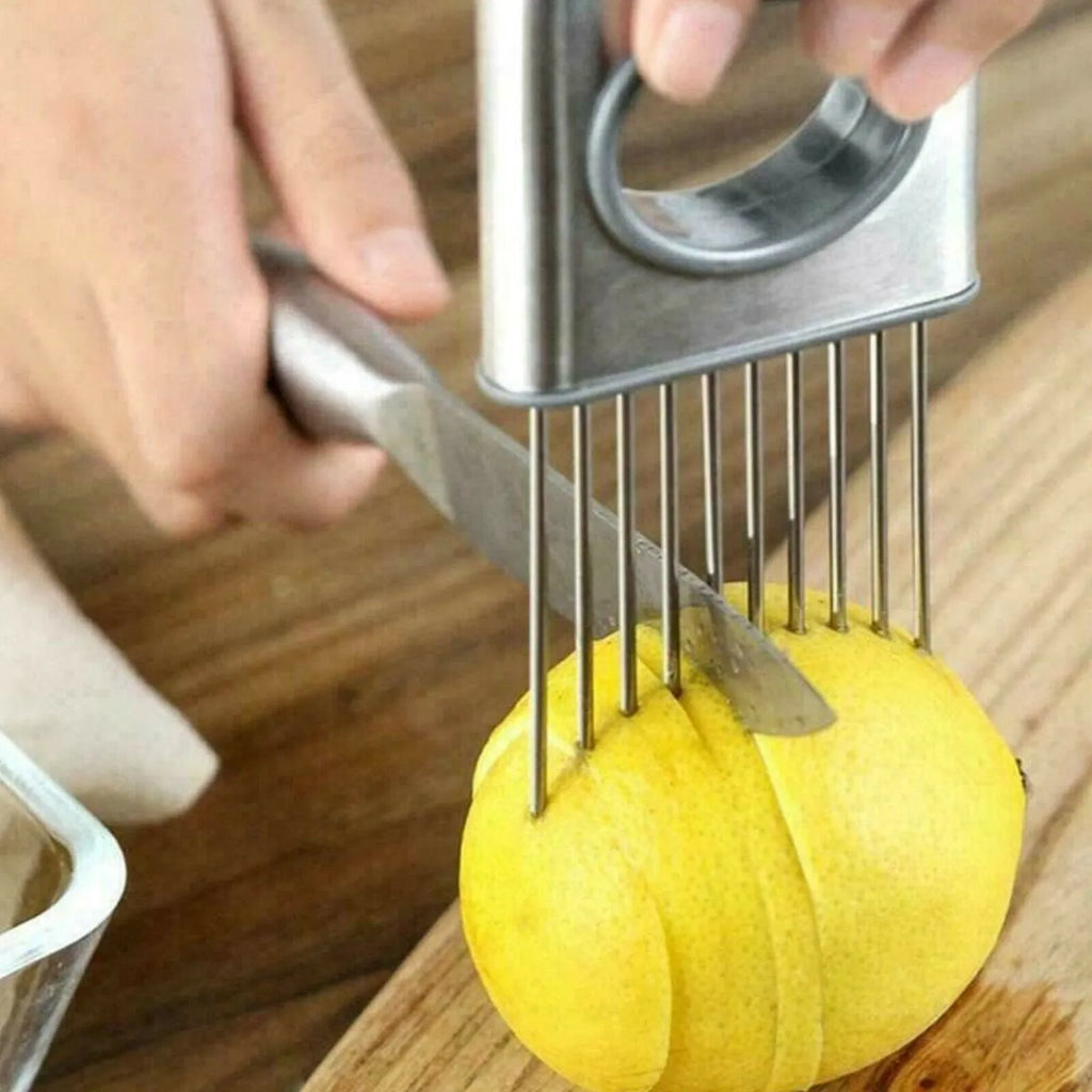 Stainless steel onion holder slicer with prongs and finger guard on a chopping board