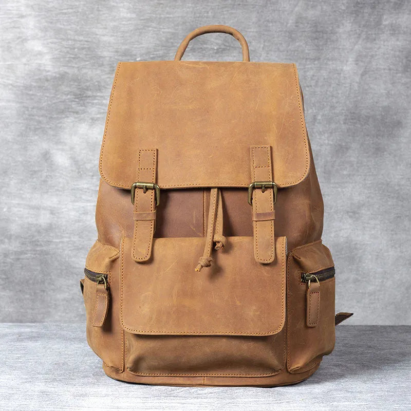 Retro brown leather backpack with double shoulder straps and vintage styling