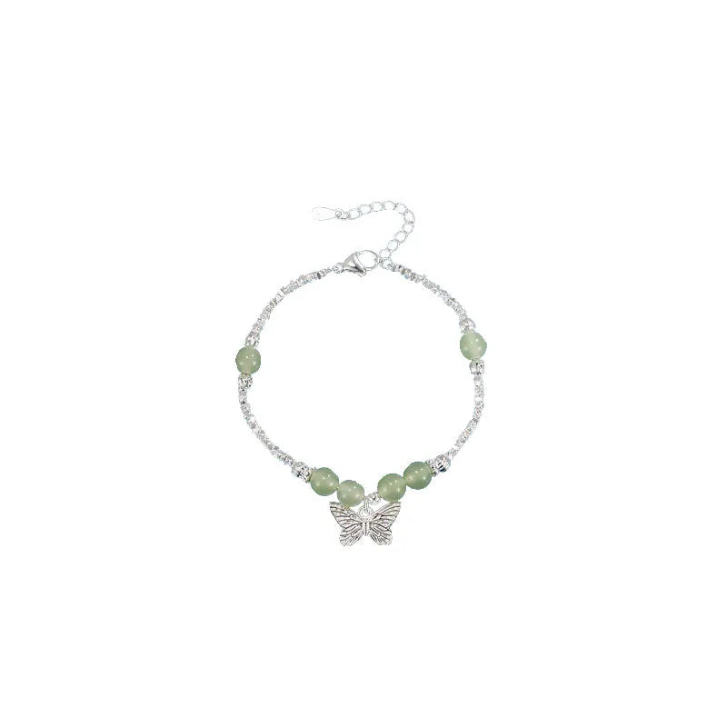 Silver butterfly jewellery set with hetian jade accents showing bracelet and necklace combination