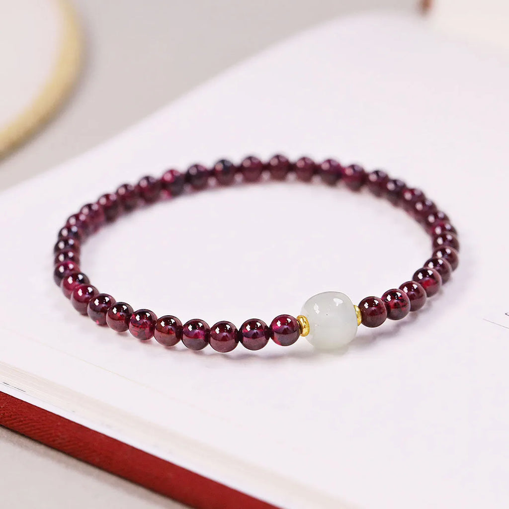 Women's U-shaped garnet bracelet in 18mm size with polished beads