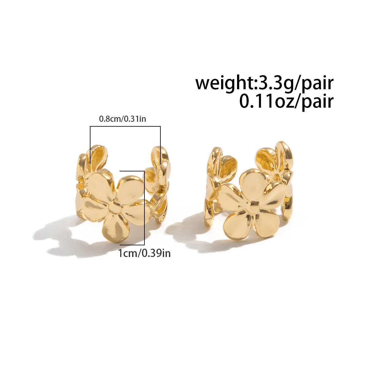 Women's gold alloy earrings with starfish and conch beach elements on post fittings