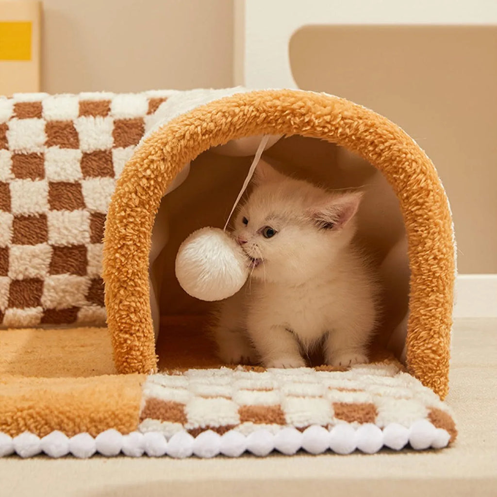 Coffee coloured plush 2-in-1 pet bed with a sleeping mat and an attached tunnel, showing anti-slip base.