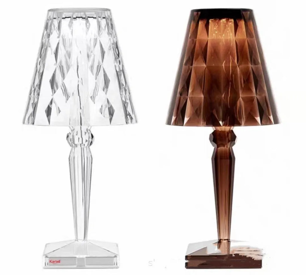 Rose gold portable touch-control projection night light on a wooden surface.