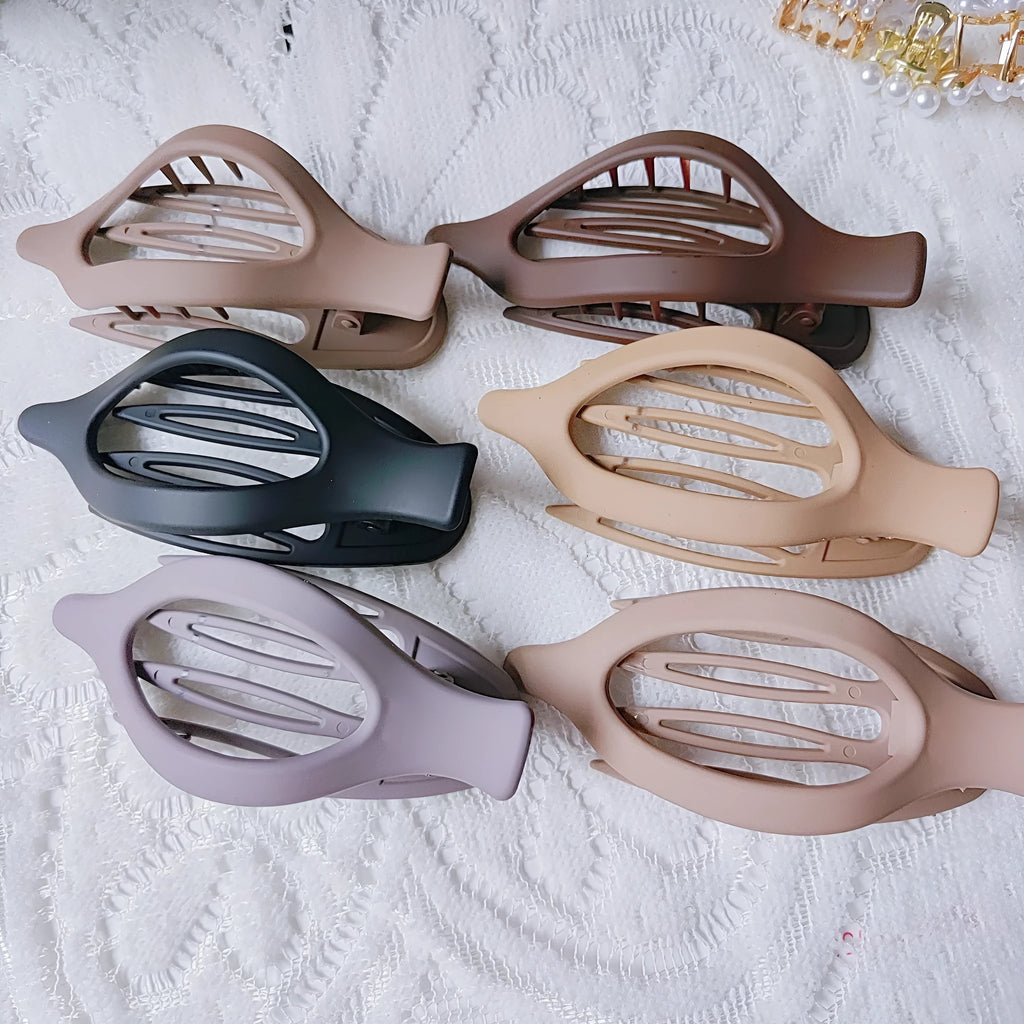 Set of six women's geometric hair clips with frosted plastic grip in rose red and nude colours