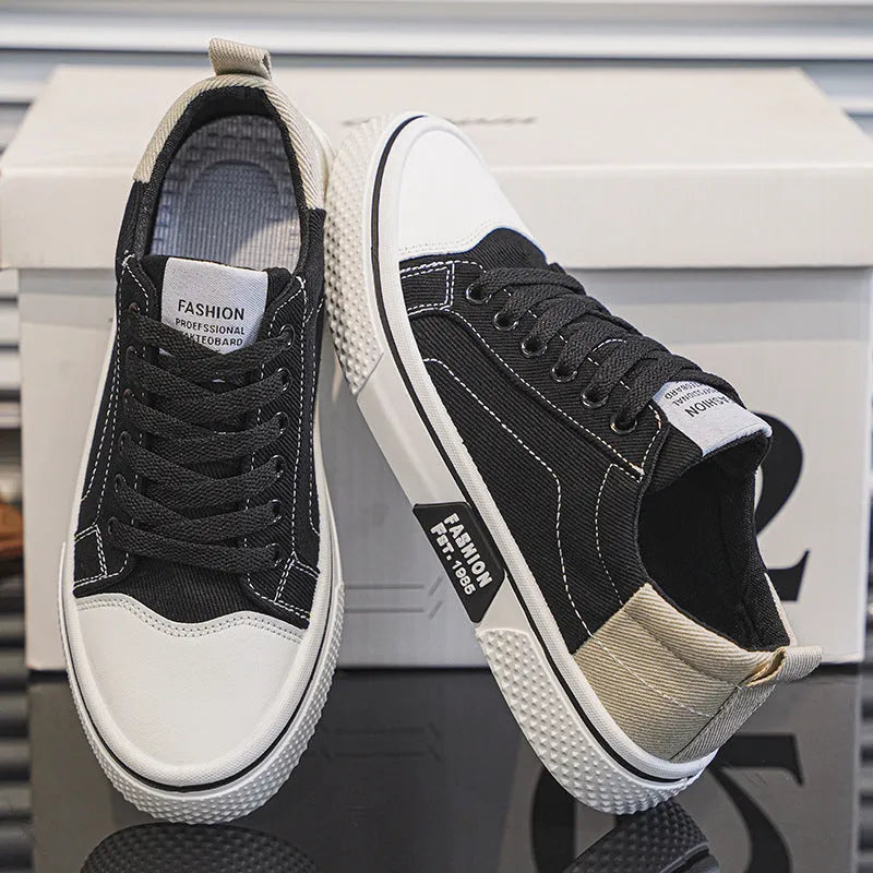 Men's low-top canvas casual shoe in blue with round toe, lace-up front, and soft PVC sole.
