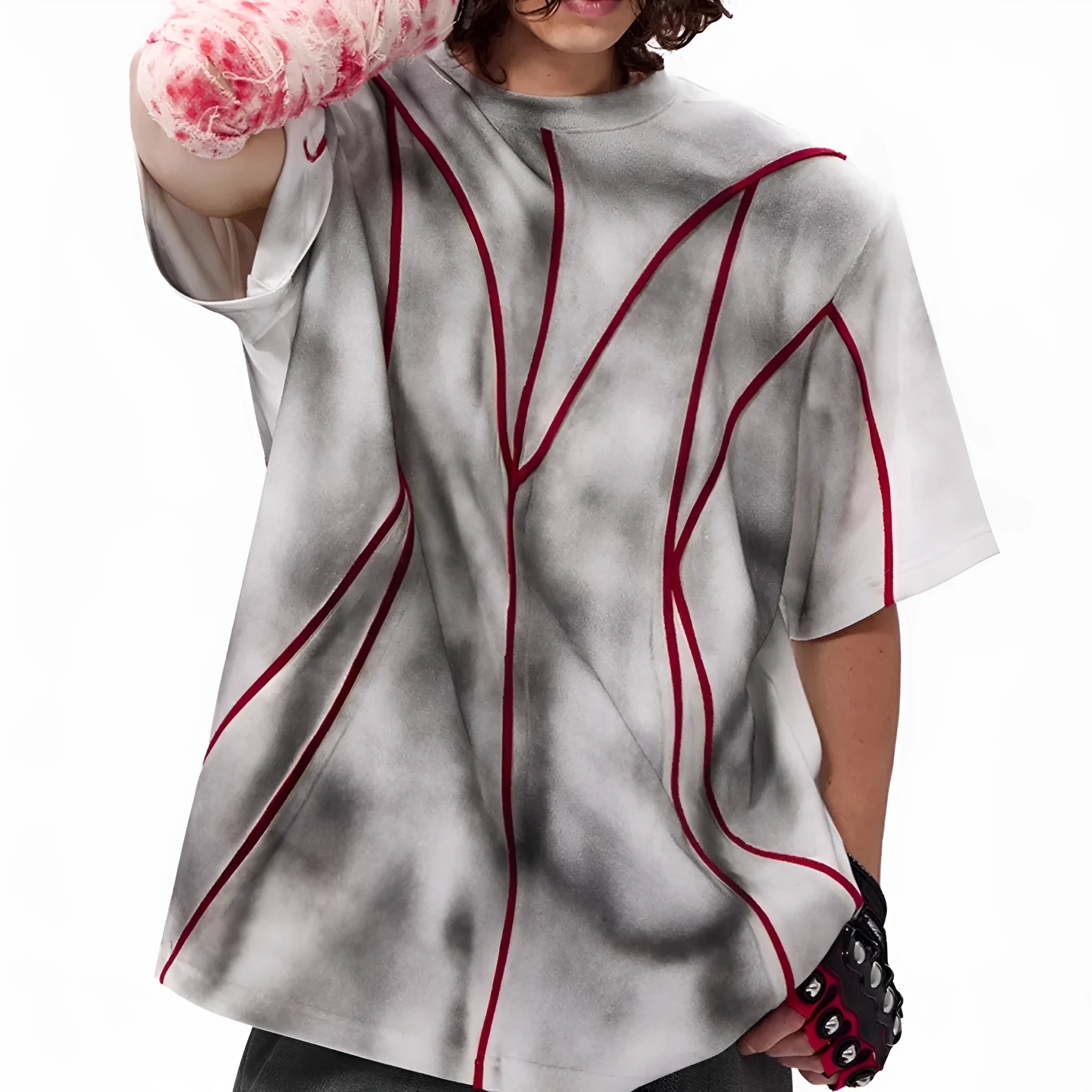 Padded shoulder short sleeve T-shirt with three-dimensional line patchwork detail on a round neck.