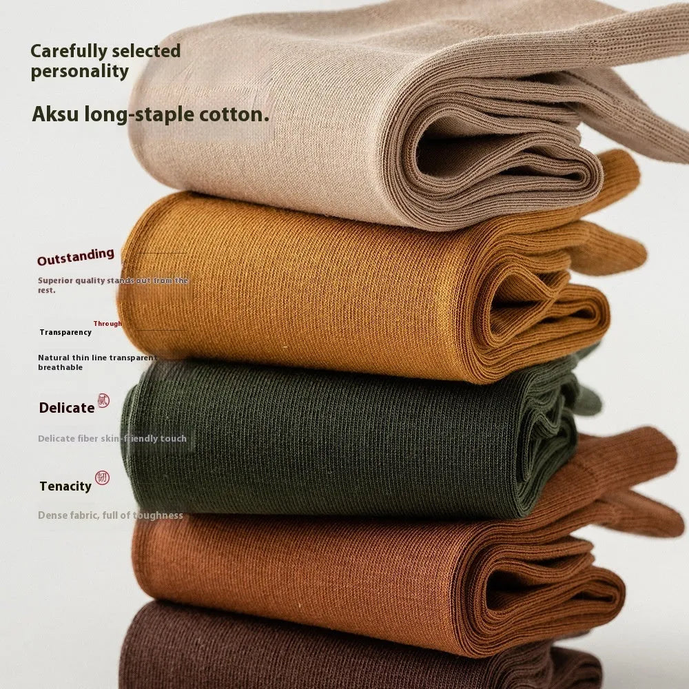 Men's mid-calf combed cotton socks in solid colours like army green, beige, and black on a white background.
