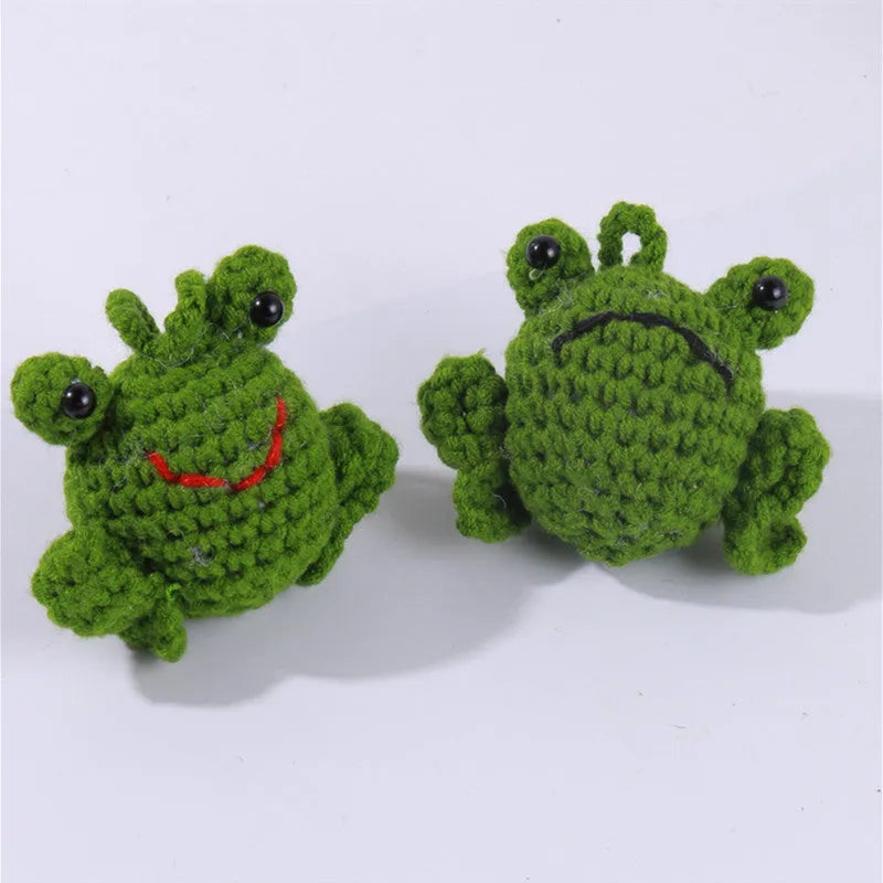 Handmade woven car pendant with small green frog design measuring 15cm long