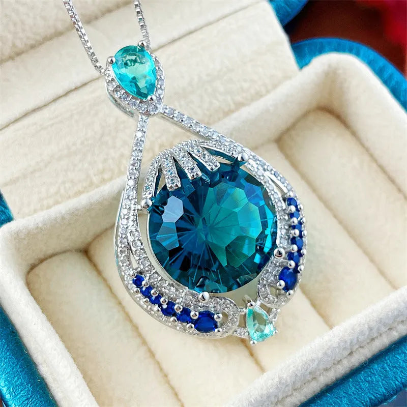 Blue crystal pendant necklace with geometric shape on water wave chain