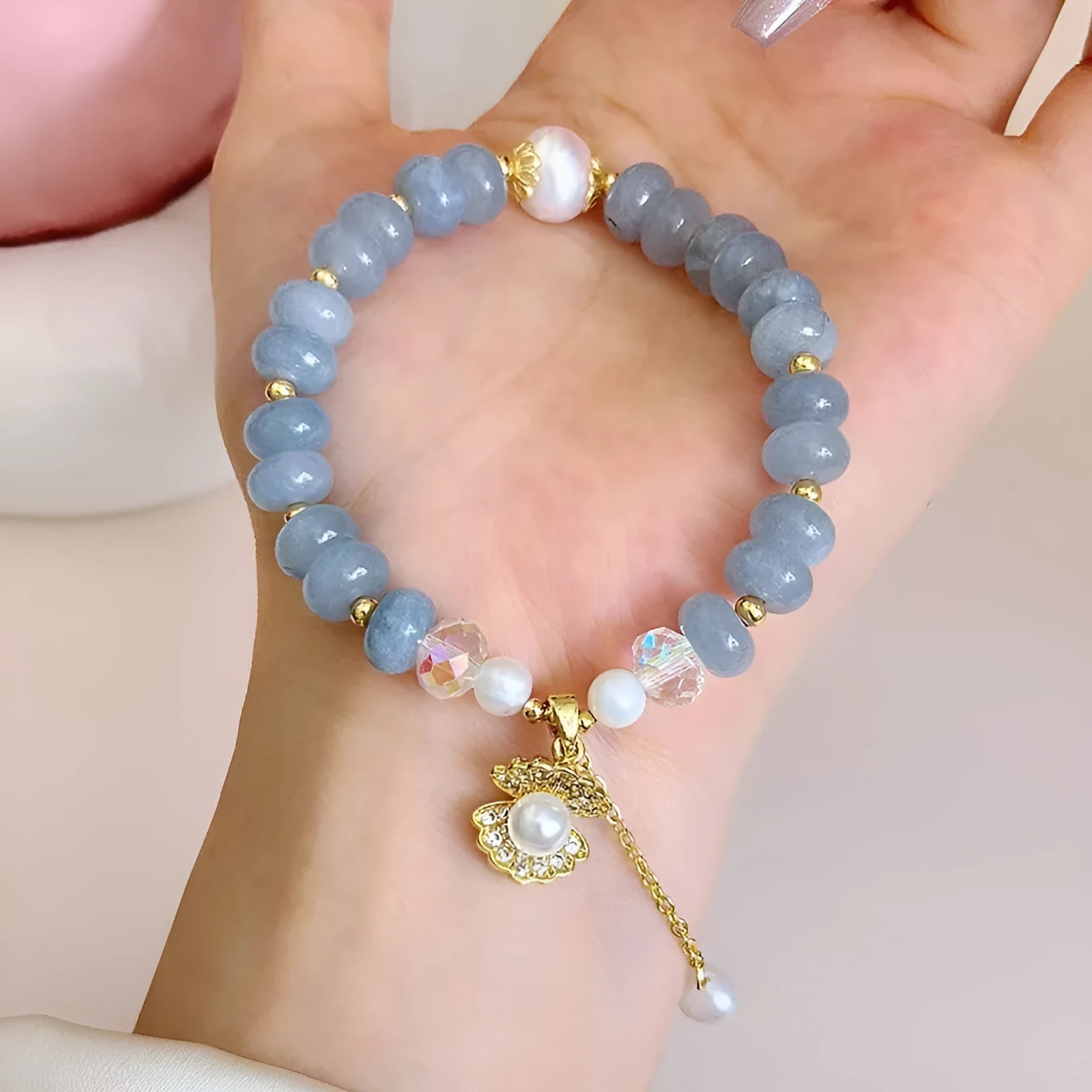 Handmade bracelet with a natural blue-green aquamarine pearl shell on an adjustable band.
