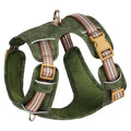 Retro-style brown leather pet harness with reflective strips on a dog.