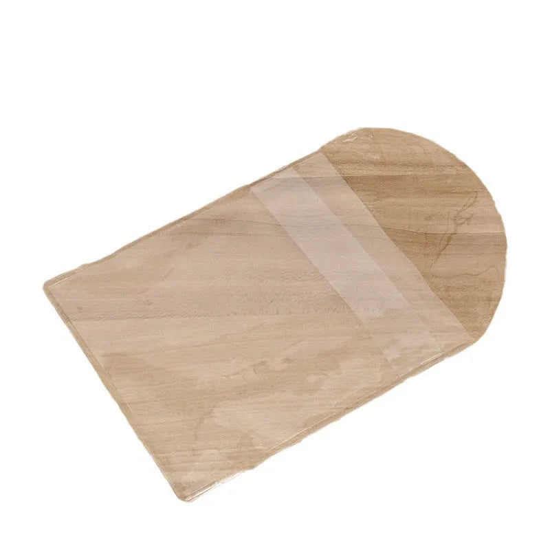 Transparent PVC soft badge bag 0.2mm thick holding coins on a flat surface