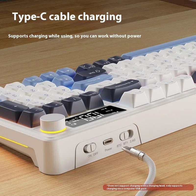 Blue and white wireless keyboard and mouse set with ball cap keycaps on a desk