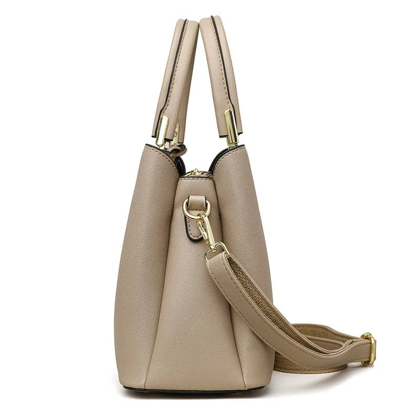 Women's black PU leather shoulder messenger bag with visible stitching and multi-layer interior.