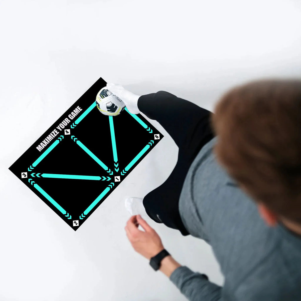 Black football training mat with grid markings measuring 60x90cm for non-slip skills practice