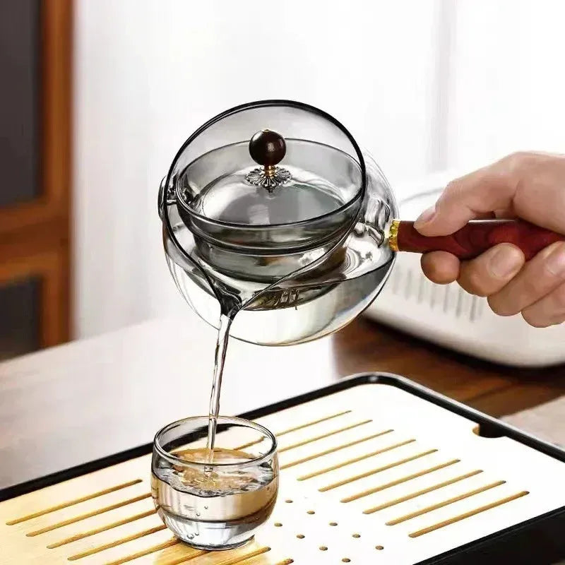 Transparent borosilicate glass teapot with wooden handle and rotation mechanism