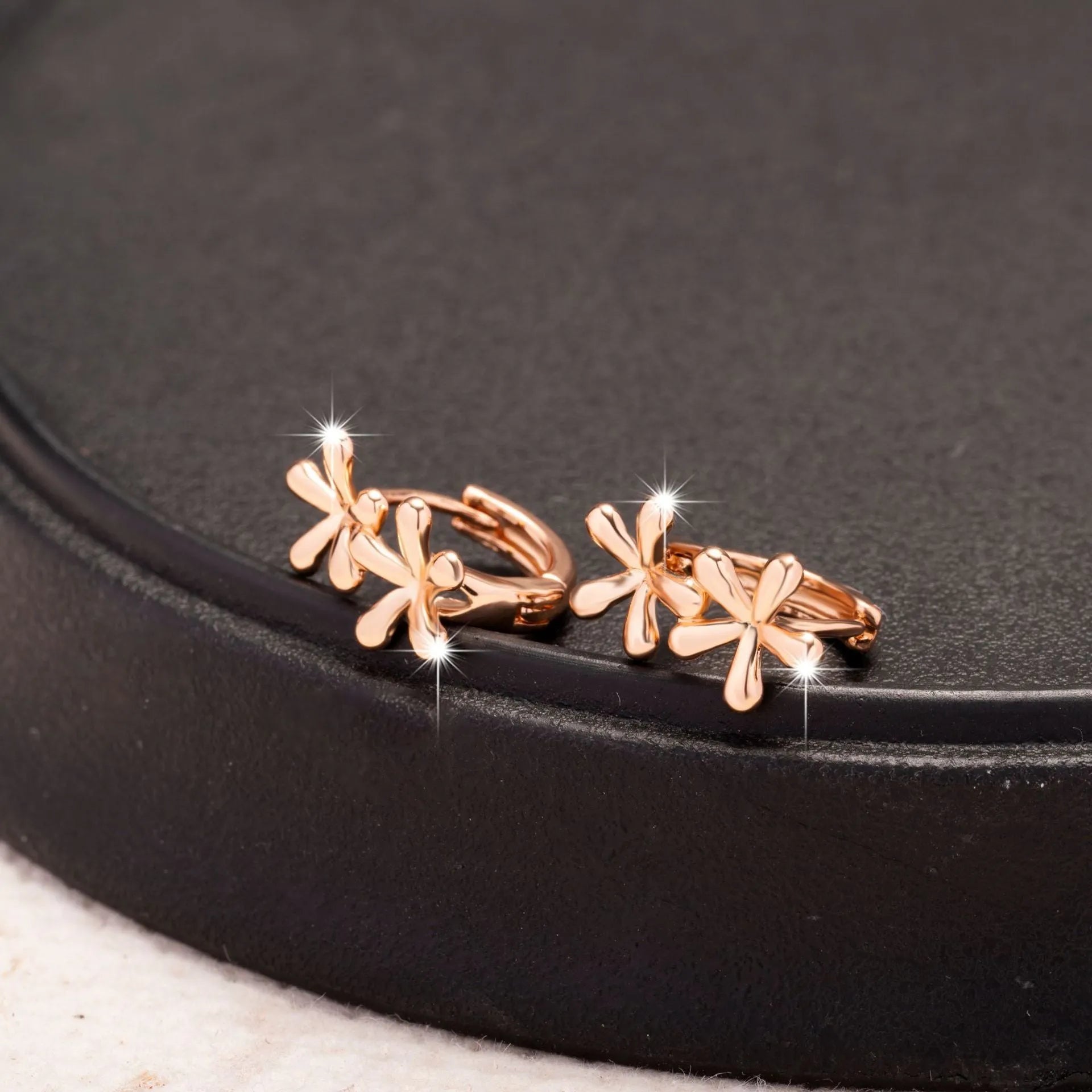 Rose gold electroplated waterdrop flower earrings with circular design for women