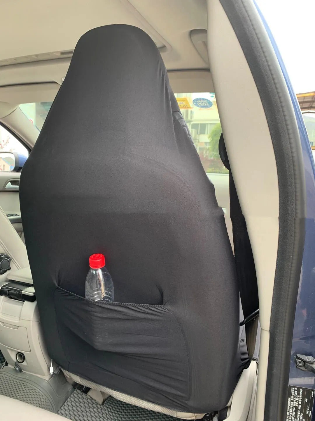 Black quilted automotive seat cover with PU and polyester fabric construction