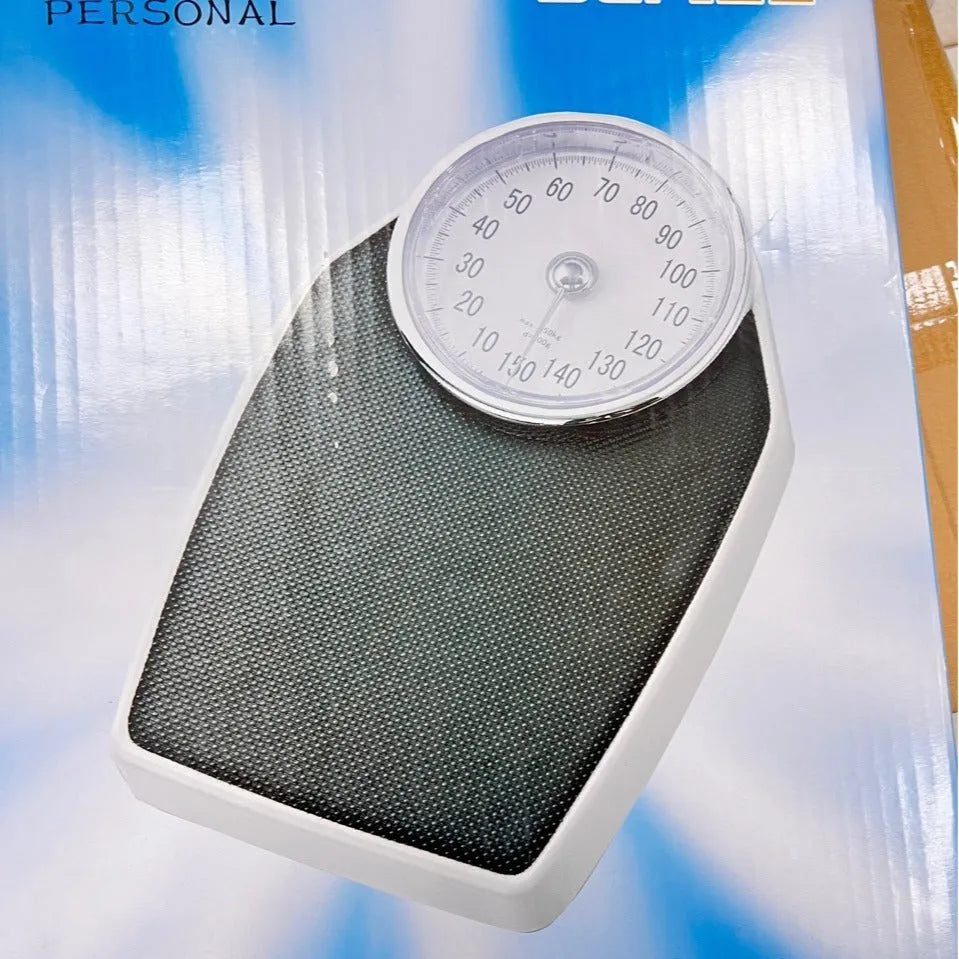 Black mechanical bathroom weight scale with large dial on a 47x35cm platform.