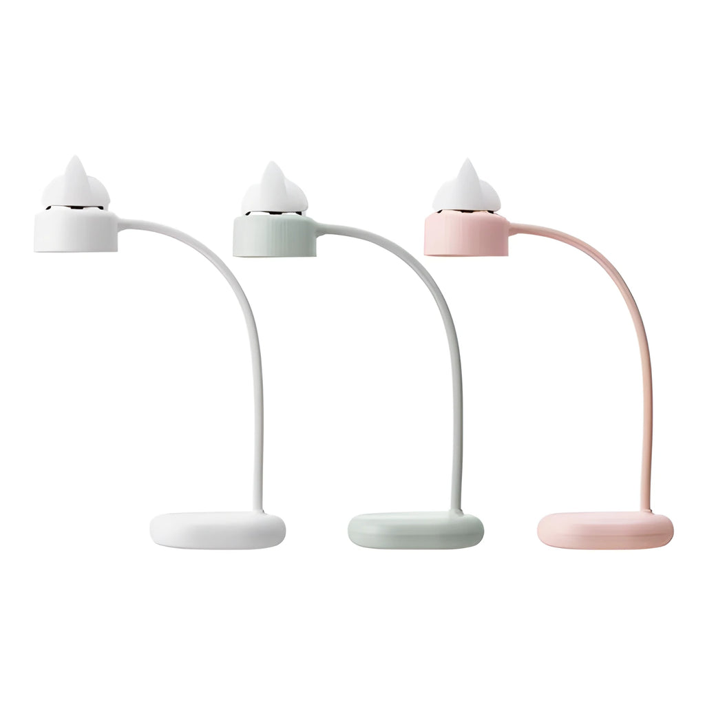 White clip-on LED desk lamp with touch controls and USB cable on a wooden desk.