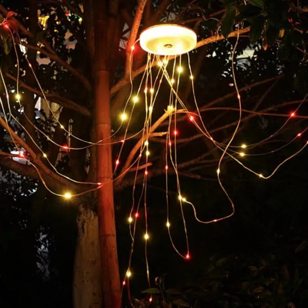 Charging multifunctional camping lantern with warm and colourful light modes on a campsite table