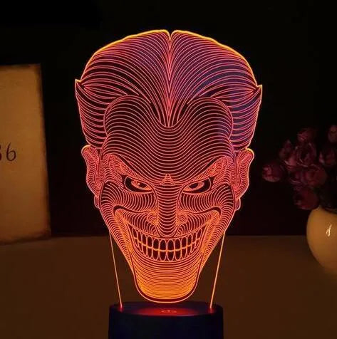 USB-powered 3D acrylic LED lamp displaying multiple colours, shown with its remote control and stand.