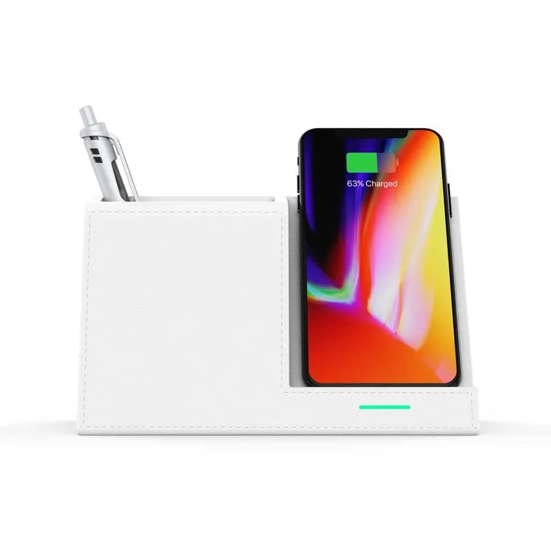 Black leather pen holder with integrated wireless phone charging pad on a desk