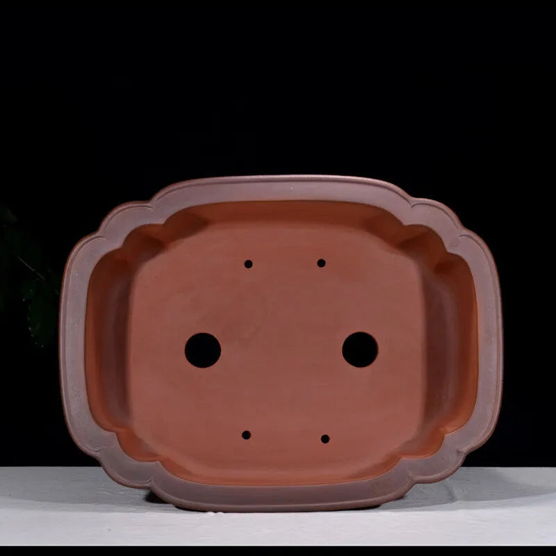 Large antique finish purple clay flower pot with Chinese tree stump design showing pine cypress pomegranate motifs