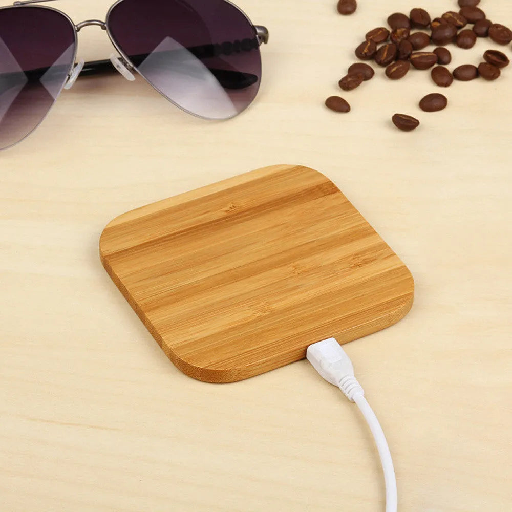 Square wooden bamboo 5W Qi wireless charger on a surface