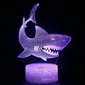 3D blue shark design LED table lamp with multi-colour lighting on a black ABS base.