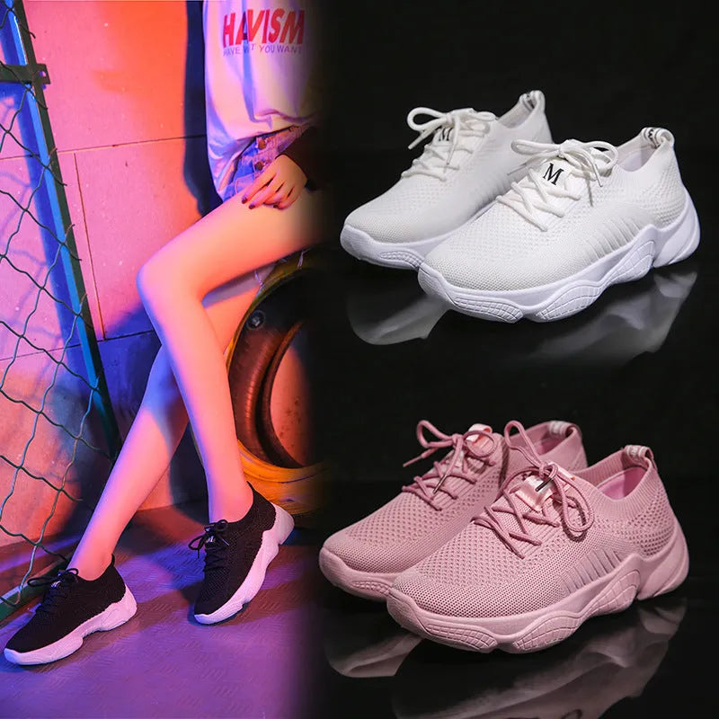Women's white thick-soled woven sports shoes with front strap on a light background.