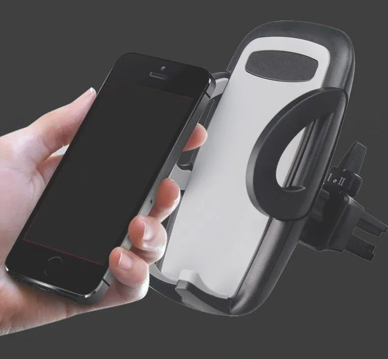 Black car phone holder clipped to air conditioning vent with smartphone secured in adjustable bracket