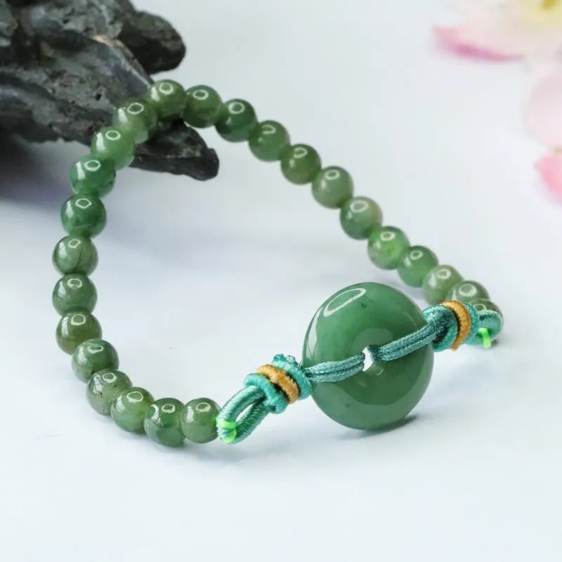 Oil green jade bracelet with safety buckle and star shape design measuring 6mm thickness