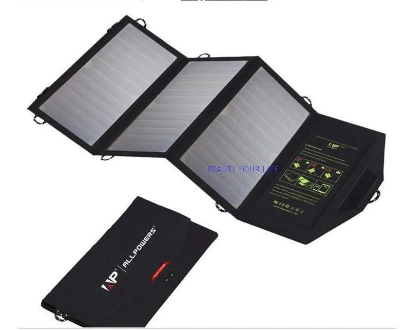 Black foldable solar panel charger with dual USB ports, shown attached to a backpack.