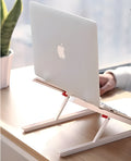 White Whale Race laptop bracket with desktop elevation and integrated heat sink base on desk
