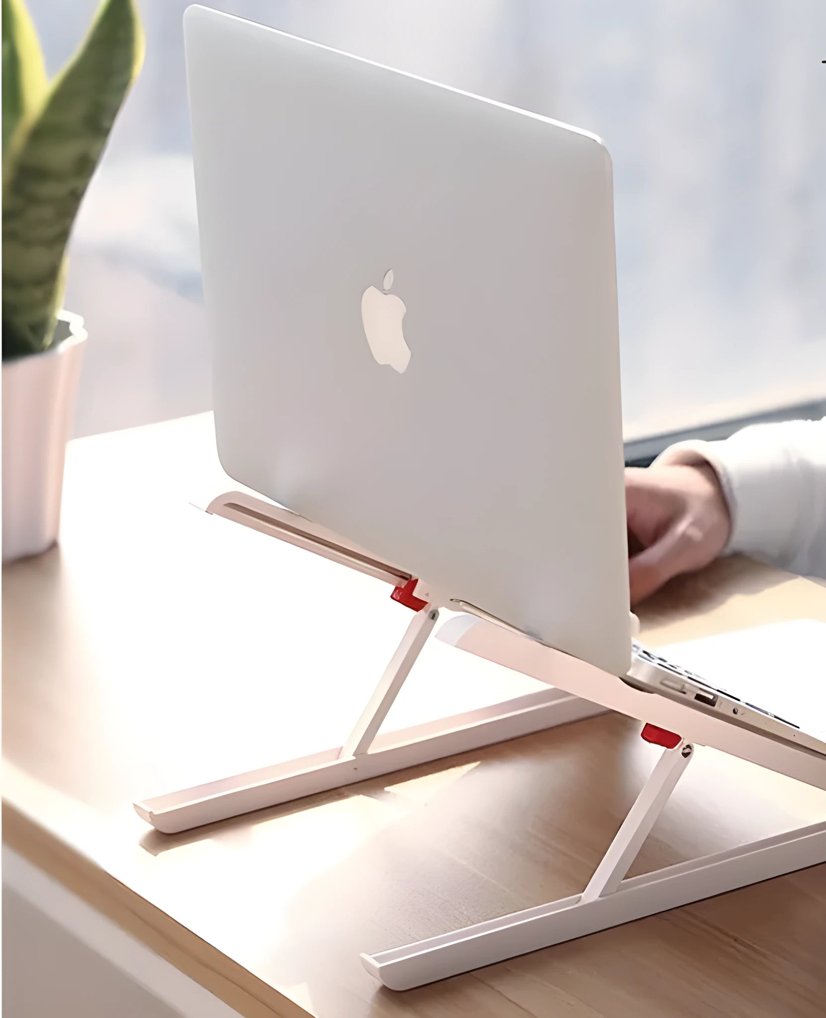 White Whale Race laptop bracket with desktop elevation and integrated heat sink base on desk